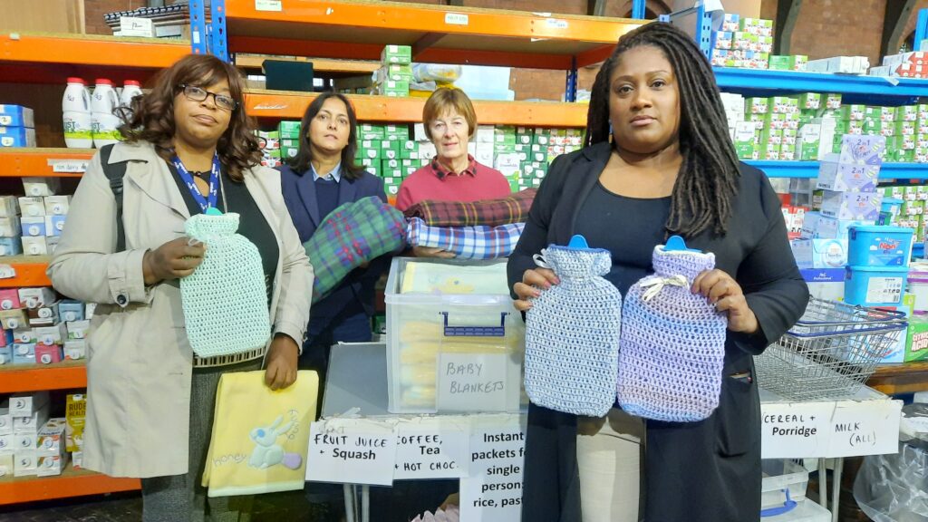 Bell at a food bank with local Labour Councillors raising awareness of the need for hot water bottles.
