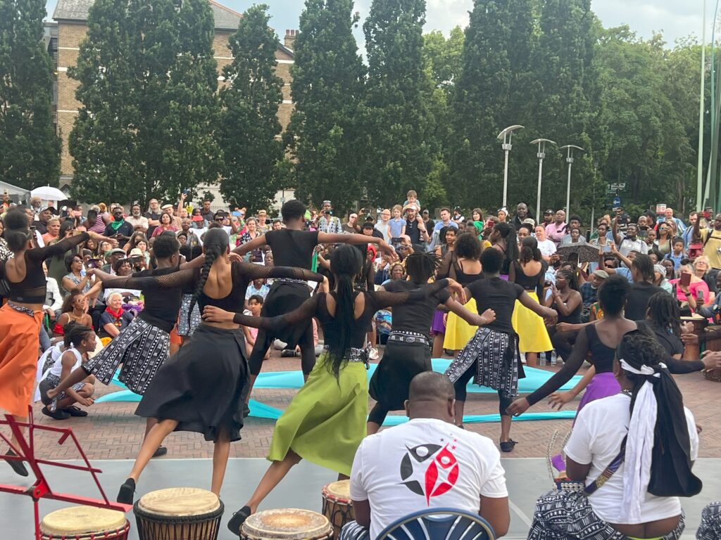 Dancers watched by a big crowd in Windrush Square.