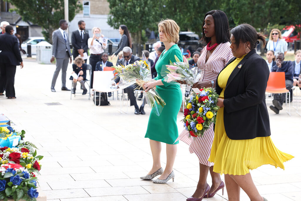Helen Hayes MP, Florence Eshalomi MP, Bell Ribeiro-Addy MP laying wreaths in Windrush Square.
